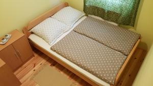 Giường trong phòng chung tại Zlatibor Apartmani DM Tornik