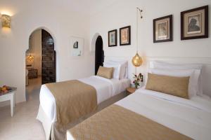 Postel nebo postele na pokoji v ubytování Marrakech Ryads Parc All inclusive