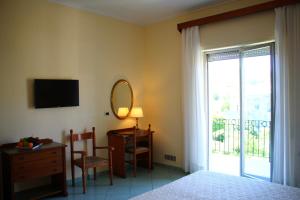 TV a/nebo společenská místnost v ubytování Hotel Terme Alexander