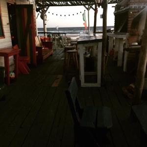 a room with a table and chairs and the ocean at La Cañada Cabo Polonio in Cabo Polonio