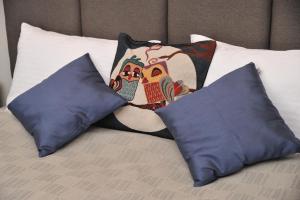 a bed with two pillows and two pillows on it at MISS Premier 19 Milmari in Kopaonik +62 photos