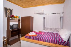 Posteľ alebo postele v izbe v ubytovaní Traditional House Maries