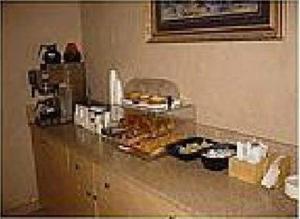a counter with a bunch of food on it at Kensington Inn - Howell in Howell