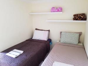 Säng eller sängar i ett rum på Hostel Trem de Minas