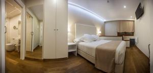 Postel nebo postele na pokoji v ubytování Hotel Boutique Barra Alta (Adults Only)