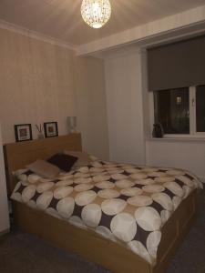 Ένα ή περισσότερα κρεβάτια σε δωμάτιο στο Sleep Well Apartment