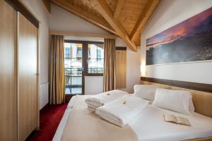 Letto o letti in una camera di Apart-Hotel Aurora Fiss