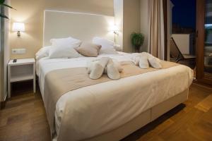 Postel nebo postele na pokoji v ubytování Hotel Boutique Barra Alta (Adults Only)
