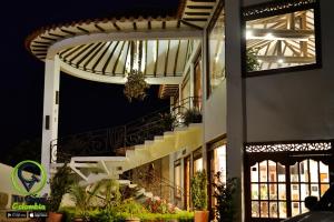 a building with a staircase on the side of it at Hotel Puente Piedra in Villa de Leyva