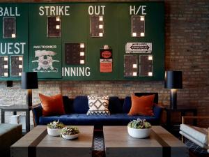 a living room with a couch and a coffee table at The Chicago Hotel Collection Wrigleyville in Chicago