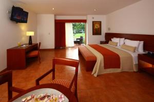 Postel nebo postele na pokoji v ubytování Hotel Las Dunas