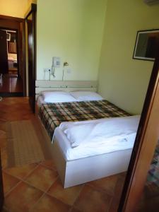 Postel nebo postele na pokoji v ubytování Hotel Pelikan