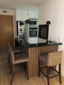 Una cocina o kitchenette en Apartamento em Gramado