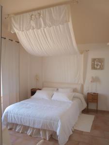 Postel nebo postele na pokoji v ubytování Le relais d'Angélique