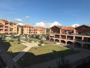 a view of a campus with buildings and a park at Palidoro House Fiumicino ROMA in Palidoro