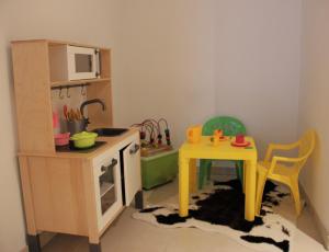 Kuchyň nebo kuchyňský kout v ubytování Villa&Loge
