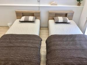 A-Style Futenma客房内的一张或多张床位