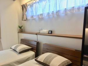 A-Style Futenma客房内的一张或多张床位