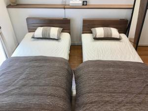 A-Style Futenma客房内的一张或多张床位