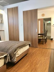 A-Style Futenma客房内的一张或多张床位