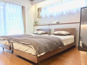A-Style Futenma客房内的一张或多张床位