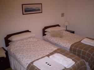 מיטה או מיטות בחדר ב-No 9 The Guest House Perth
