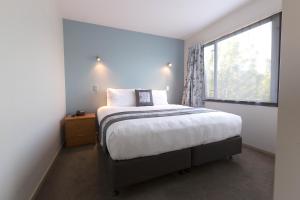 Postel nebo postele na pokoji v ubytování Riccarton Motor Lodge