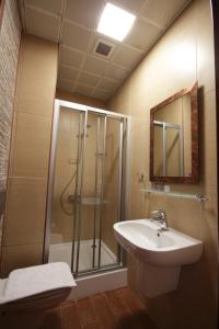 a bathroom with a shower and a sink at Konya Dervish Hotel in Konya