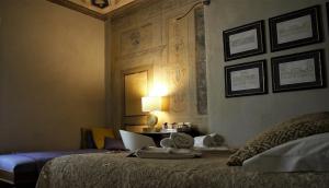 Postel nebo postele na pokoji v ubytování LO studiO B&B