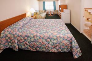 Katil atau katil-katil dalam bilik di Majestic Hotel & Apartments