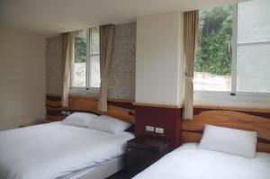 知本正好運溫泉民宿 房間的床