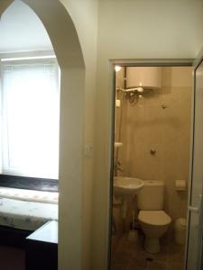 a bathroom with a toilet and a sink at Guesthouse Tzar Asen in Sofia