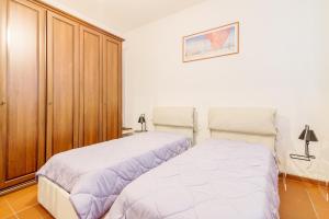 Posteľ alebo postele v izbe v ubytovaní Torre dell'Orologio Apartment