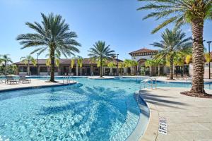 a large swimming pool with palm trees in a resort at Solterra - 6 Bedrooms House w/pool-7040SR in Davenport