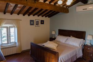 a bedroom with a bed and a window at Ai Bastiani in Capannori +26 photos