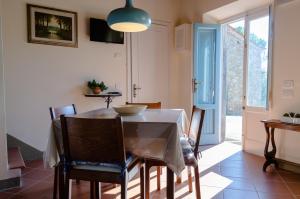 a dining room with a table and some chairs at Ai Bastiani in Capannori