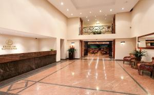 a lobby of a hotel with a reception at Hotel Estelar Suites Jones in Bogotá