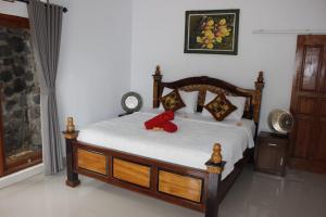 Postel nebo postele na pokoji v ubytování Sekumpul Accommodation