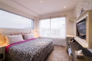 Кровать или кровати в номере Summerbird - Bed and Brasserie