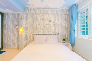 Postel nebo postele na pokoji v ubytování Qcub3 Homestay