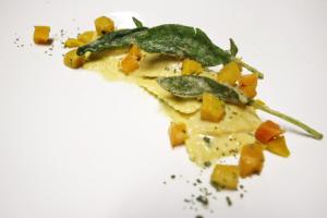 a piece of food on a white plate at Hotel Villa Margherita in Quercianella