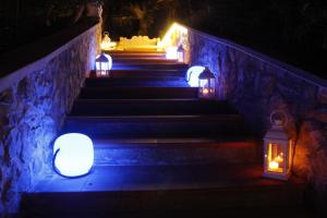 a group of lights on the stairs at night at Hotel Villa Margherita in Quercianella
