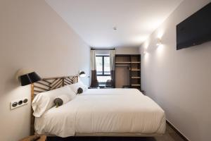 Voodi või voodid majutusasutuse Hotel Rural Sagarlore toas