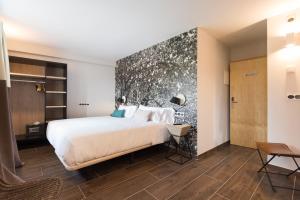 Voodi või voodid majutusasutuse Hotel Rural Sagarlore toas