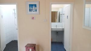 a bathroom with a sink and a mirror at Aquaman @chalong pier in Chalong +41 photos