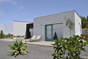 a white house with plants in front of it at VILLA HORIZONTE in Puntagorda