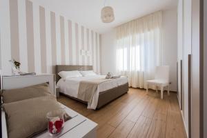 Posteľ alebo postele v izbe v ubytovaní B&B Aries