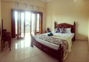 Кровать или кровати в номере Pondok Ayu Homestay