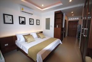 Postel nebo postele na pokoji v ubytování TSE Residence [by Samui Emerald]