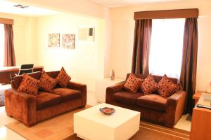 Khu vực ghế ngồi tại Olimpo Hotel & Suites